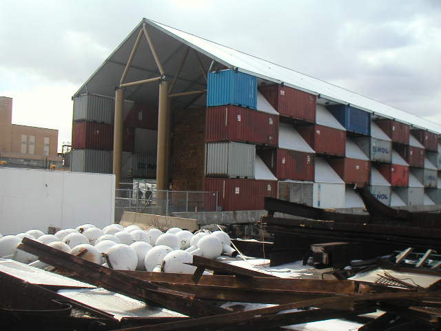 Shigeru Ban, The Nomadic Museum. Shipping container walls, steel roof supported by cardboard trusses